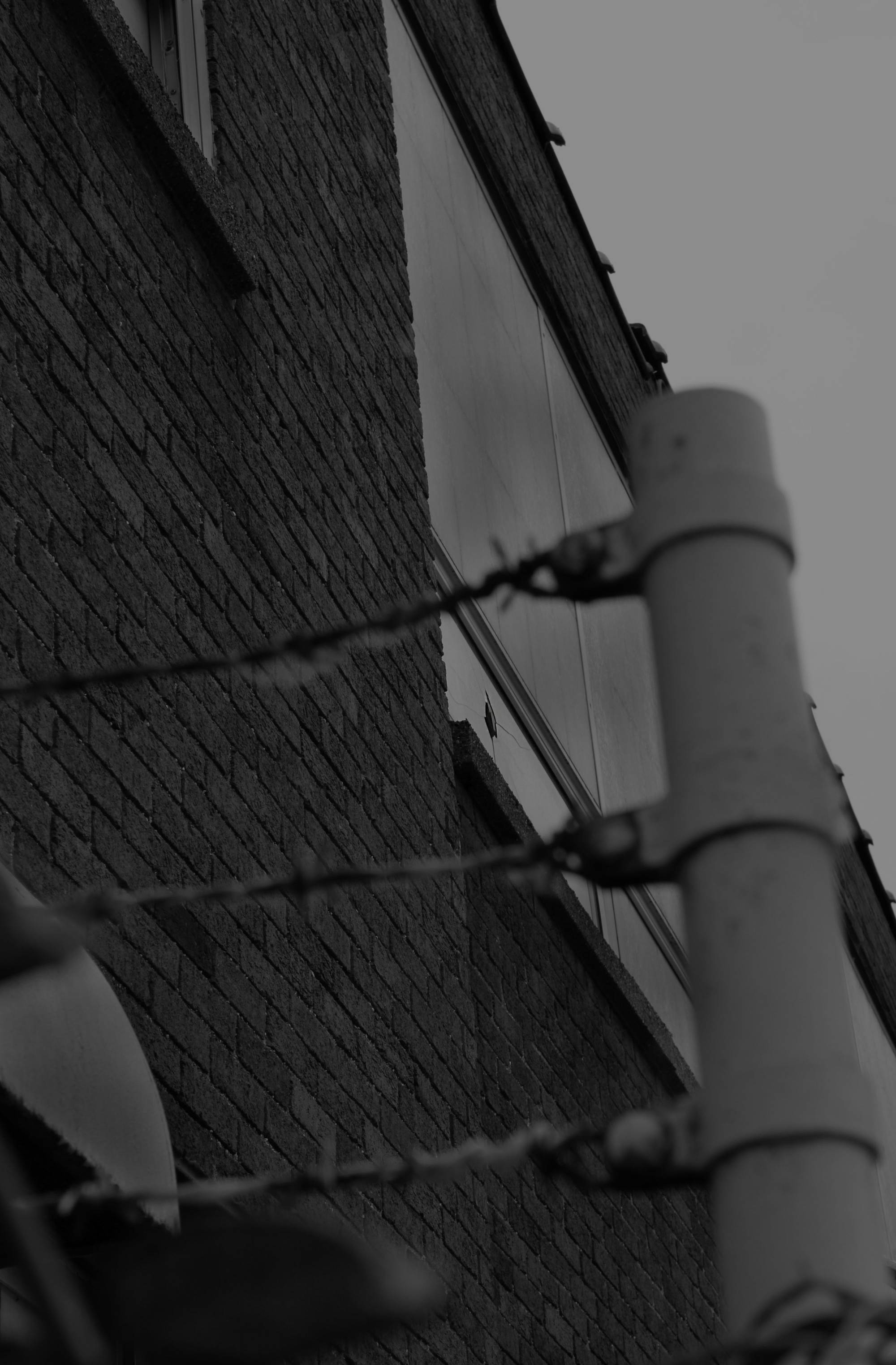 Black and white photograph of the side of a building.